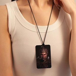 Detailed close-up of a Black Myth Wukong rectangular steel pendant necklace on a model