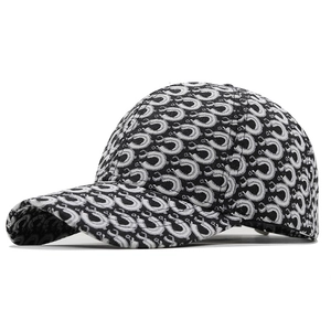 Women's black and white jacquard baseball cap with repeat pattern and curved brim