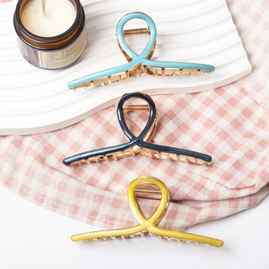 Set of three large alloy claw clips in light blue, dark blue, and yellow for women's hair