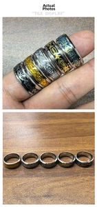 Macro detail of stainless steel Jesus fish rings set in gold, silver, and black finishes