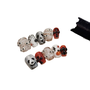 Halloween press-on nails featuring 3D pumpkin, skull, and spider web gothic art designs