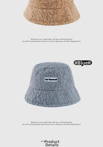 Close-up of thick sherpa fleece bucket hats with letter patches and soft fuzzy textures