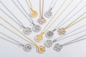 Collection of clover and spiritual symbol necklaces in gold, silver and rose gold