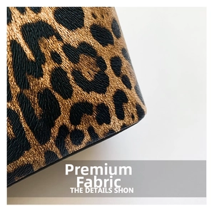 Close-up of leopard print texture on leather bucket bag with premium grain details