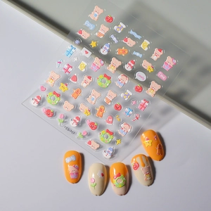 Close-up of 3D cartoon nail stickers featuring cute bears and colorful flowers