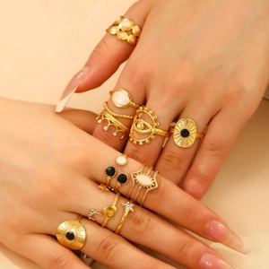 Set of 10 golden bohemian rings with sun, moon and celestial motifs for women