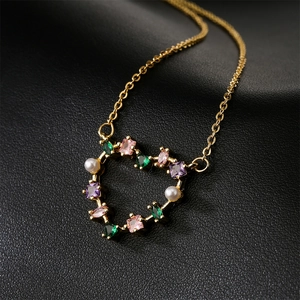 18K gold plated heart pendant necklace with colorful gemstones and pearls on black leather