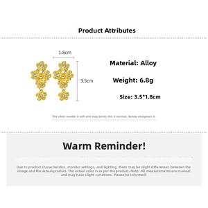 Detailed view of gold flower drop earrings with cubic zirconia and size measurements
