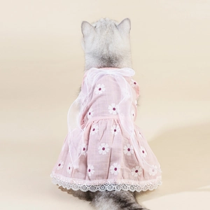 Pink and white floral pet dress with lace hem and large chiffon bow on a cat back
