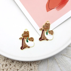 Detail of cute brown bear on a scooter alloy charm for DIY jewelry with gold metal edges