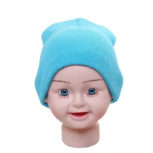 Light blue knitted infant beanie for winter, warm stretch wool hat on white background
