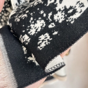 Ink painting style cashmere-feel scarf featuring black and white houndstooth knit texture