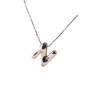 Polished silver metal letter N pendant necklace with a classic sleek box chain