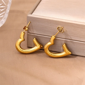 Polished 18K gold-plated stainless steel heart-shaped stud earrings on satin