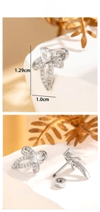 Detailed close-up of bow knot stud earrings with cubic zirconia and heart center stone