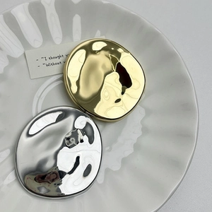 Minimalist irregular round metal brooches in gold and silver finish with wavy texture