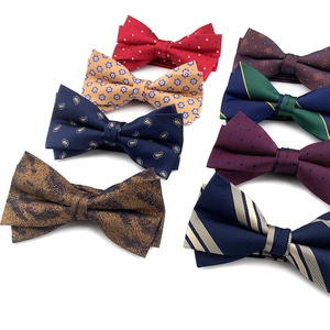 Assorted collection of stylish men's fabric bow ties in various colors and patterns