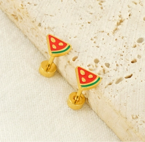Detail of gold-plated watermelon stud earrings with red and green enamel on stone