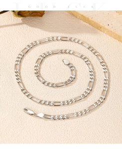 Close-up of S925 sterling silver Figaro chain with authentic hallmark and link details