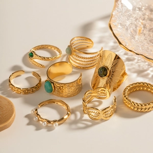 Bohemian gold ring set with natural turquoise and malachite on a warm minimalist background