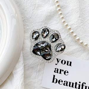 Macro detail of luxury rhinestone cat paw phone socket with sparkling crystal inlay