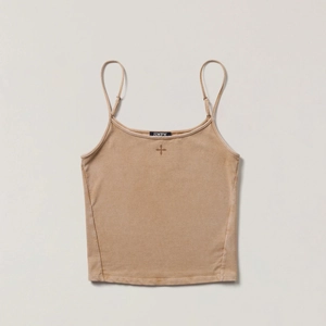 Detail of the cross embroidery and thin shoulder straps on this khaki cotton camisole top