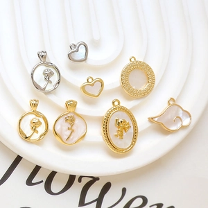Gold plated heart and flower charms with mother of pearl inlay for DIY jewelry making
