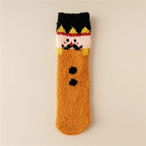 Detail view of plush coral fleece Christmas socks featuring cartoon character embroidery