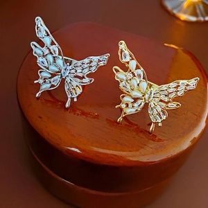 Adjustable gold and silver butterfly rings with pearls and sparkling cubic zirconia