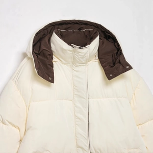 Short cream quilted puffer jacket with contrast dark brown lining and stylish stand collar