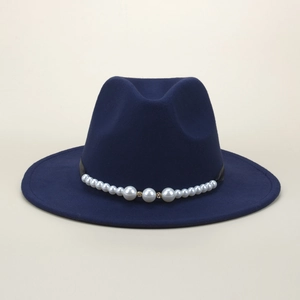 Detail of dark blue fedora hat with elegant pearl band and rhinestone decoration
