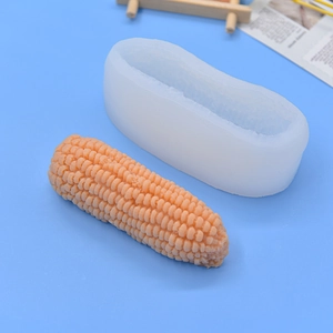 Realistic corn-shaped silicone mold for DIY fondant and baking on a blue background