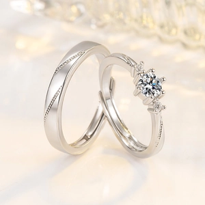 Polished silver adjustable couple rings set with shimmering four-prong moissanite stones