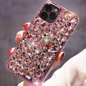 Detailed view of luxury heart phone case with pink rhinestones and crystals