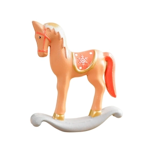 Nordic Christmas rocking horse ornament in orange and gold with snowflake details