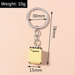 Detail view of a 10g yellow washing machine keychain with size measurements