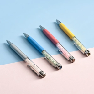Elegant metal ballpoint pen set with colorful crystals and sleek metallic finish