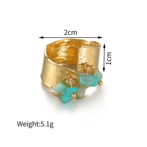 Detail view of gold chunky ring with irregular stones and specific 1cm width scale