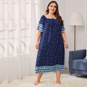 Detail of plus size navy floral nightgown featuring lace square neck and geometric hem