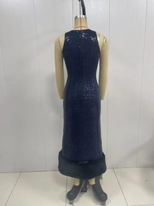 Detail of sequined long dress back with deep blue glitter fabric and plush fur trim hem