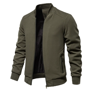 Detail of army green waffle-weave jacket with thick black fleece lining and stand collar