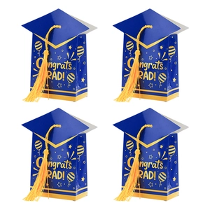 Blue graduation candy gift boxes with gold tassels and Congrats Grad text on white background