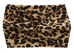 Macro view of leopard print wide twist headband with soft elastic knitted texture