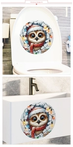 Detailed view of owl Christmas decal applied on toilet cover and bathroom cabinet surfaces