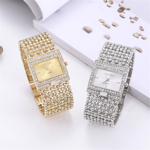 Detailed close-up of luxury square quartz watches in gold and silver with crystal accents