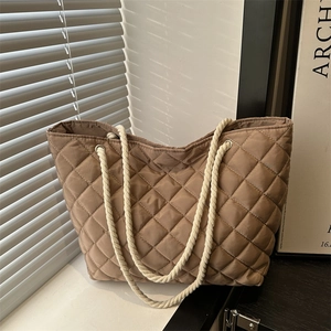 Quilted brown tote bag with white rope handles and large capacity diamond stitching