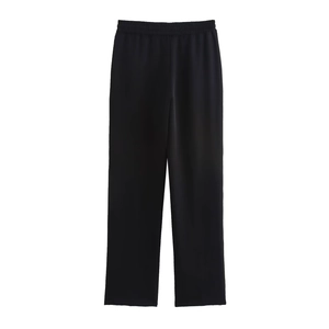 Detailed view of women's black straight-leg sweatpants with an elastic waistband