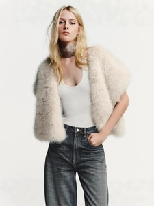 Short faux mink fur vest in cream white for women shown as a stylish winter outerwear piece