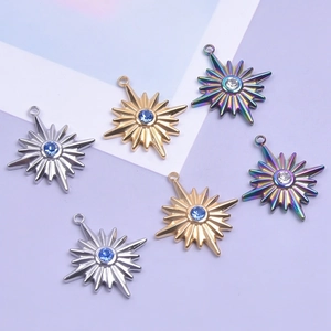 Detailed view of colorful stainless steel star pendants with inlaid zircon crystals
