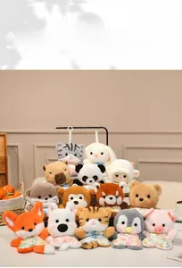 Close-up of cute dumpling-shaped plush animals with floral bibs for kids gift